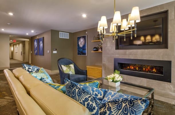 Cozy lounge area with modern decor and fireplace