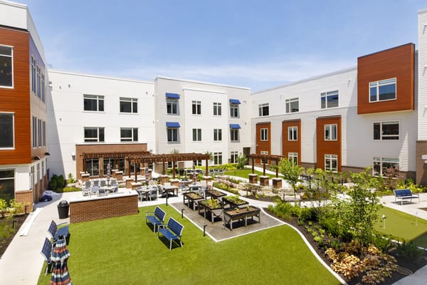 Bright outdoor area with seating and gardens