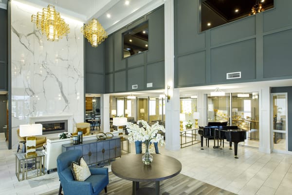 Modern lobby area with elegant decor and piano