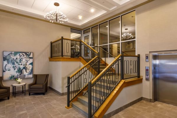 Bright interior lobby with stairs and seating area