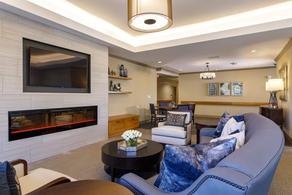 Cozy common area with comfortable seating and a fireplace