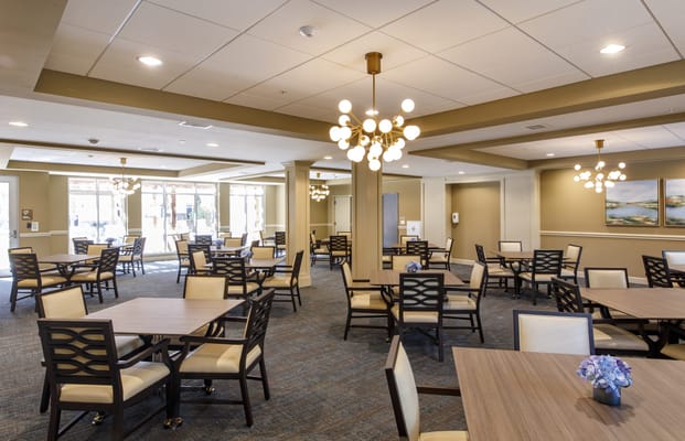 Bright dining area with tables and chairs