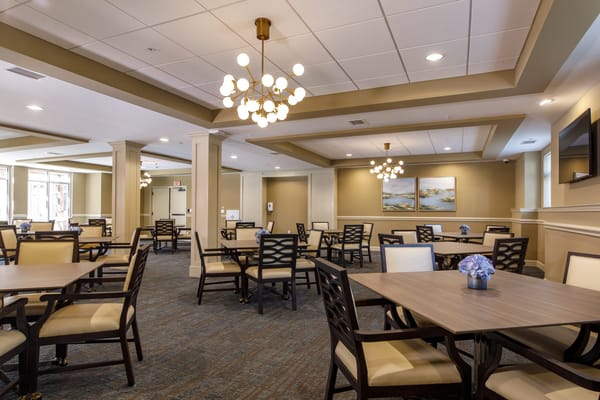 Bright and modern dining area with tables and chairs