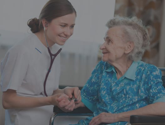 Nurse engaging with elderly resident in a facility