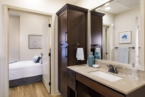 Bright bathroom and bedroom in a senior living unit