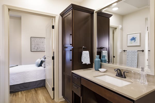 Bright bathroom and bedroom in a senior living unit
