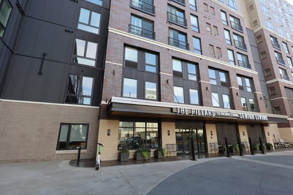Entrance of The Pillars of Prospect Park senior living facility