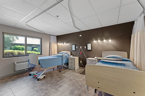 Interior view of a resident's room with two beds