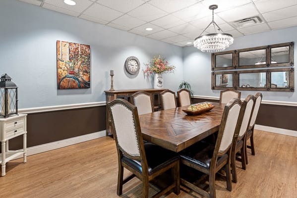 An elegant dining area with a large table and decor