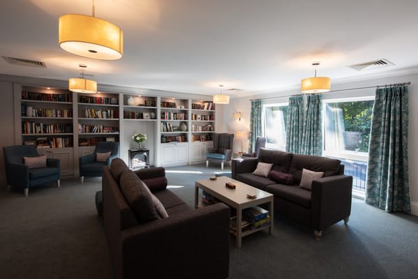 Cozy common area with bookshelves and seating
