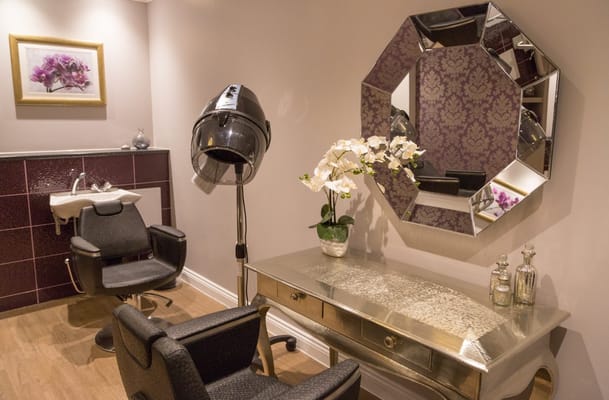 Hair salon area with styling chairs and equipment