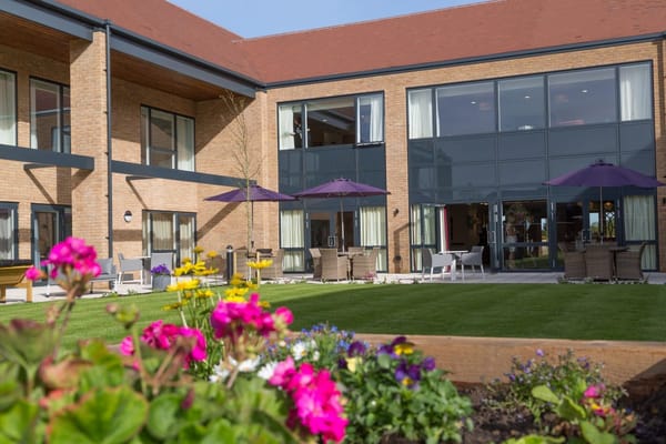 Outdoor seating area with flower garden