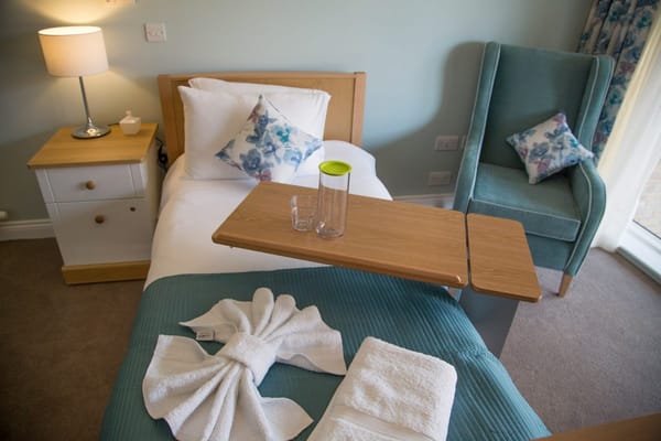 Cozy resident room with a bed and seating area