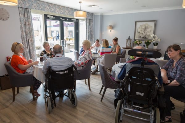 Residents engaging in conversation in a shared space