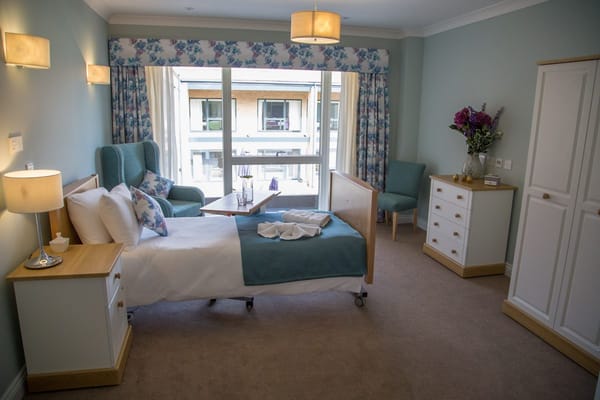 A well-furnished private resident room with natural light