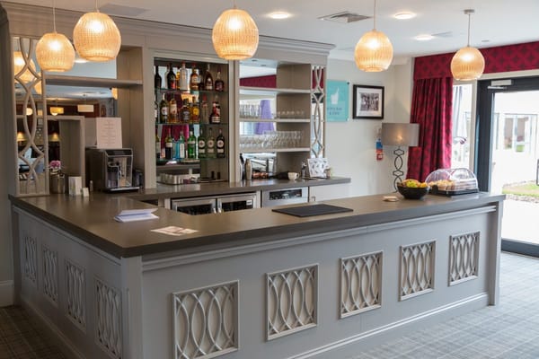 Interior view of a care home bar area with seating