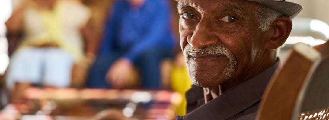 Resident smiling in a common area setting