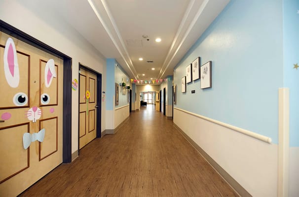 Bright hallway with decorated resident doors