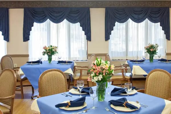 Bright dining room with tables elegantly set