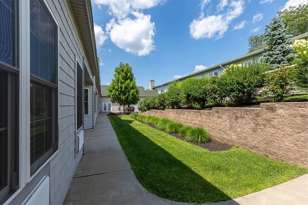 Well-maintained garden pathway leading through the facility