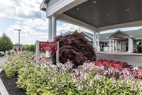 Entrance of Fairview Senior Living with flower beds