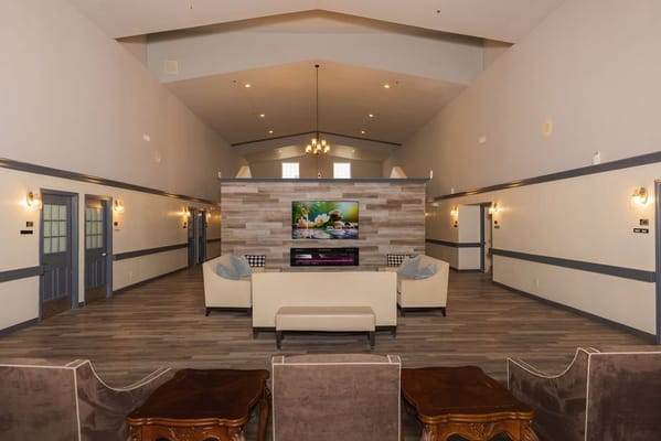 Bright common area with couches and a television