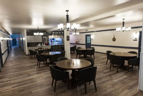 Interior view of a dining room with round tables