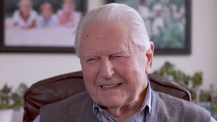 Smiling elderly man in a cozy setting