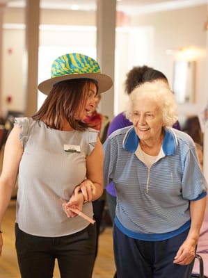 Staff assisting a resident during an activity