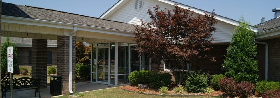 Exterior view of the facility with landscaping