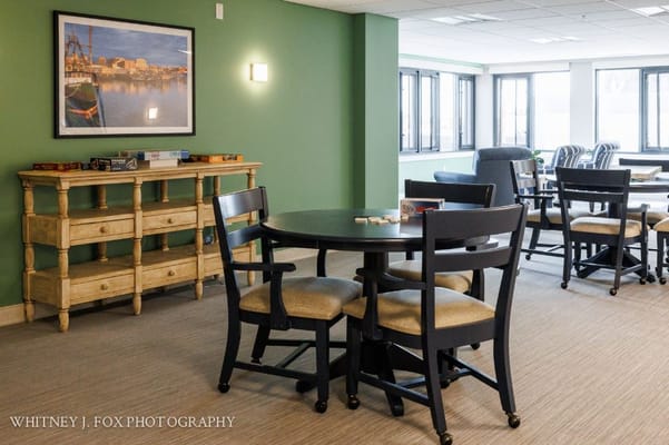 Interior view of a common area with seating and artwork