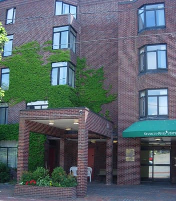 Exterior view of assisted living facility with ivy