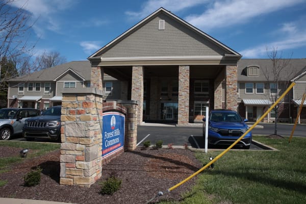 Exterior view of Forest Hills Commons with sign