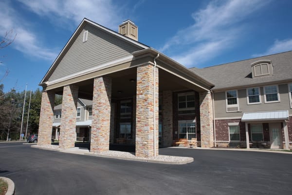 Front entrance of Forest Hills Commons with stone columns