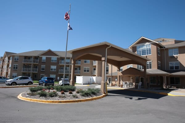 Entrance of Holiday Oxmoor Lodge with flag and covered area