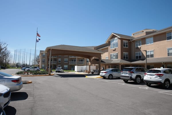 Exterior view of Holiday Oxmoor Lodge entrance and parking