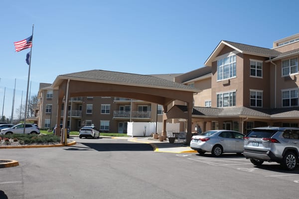 Exterior view of Holiday Oxmoor Lodge with parking area