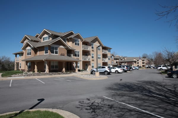 Building exterior of Holiday Oxmoor Lodge with outdoor parking