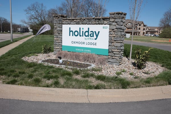 Facility signage for Holiday Oxmoor Lodge