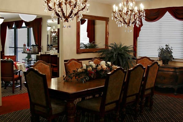 Elegant dining room with chandeliers and a large table