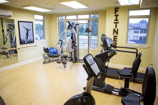 Well-equipped fitness room with exercise machines