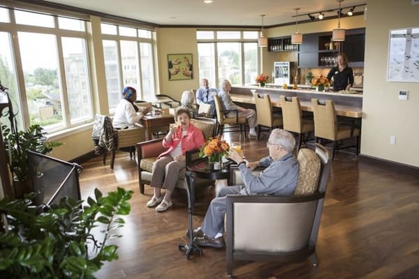 Residents enjoying a social gathering in a common area
