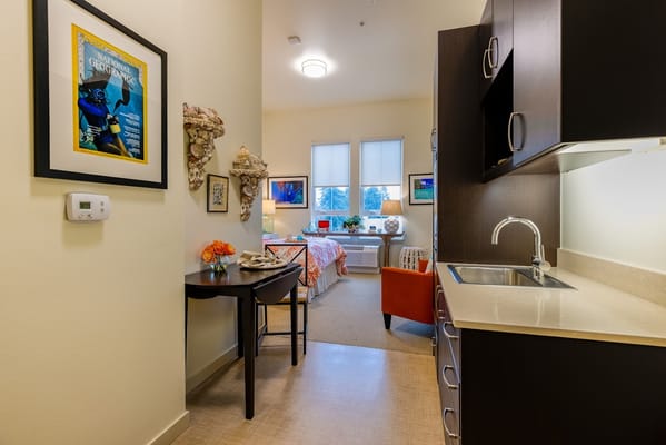Interior view of a private resident room with kitchenette