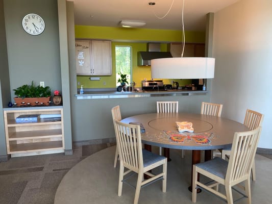 Bright interior common area with a dining table