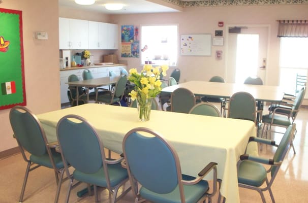 Bright common area with tables and chairs