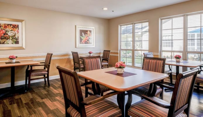 Bright common area with tables and chairs