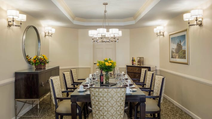 Elegant dining room setup with flowers and stylish decor