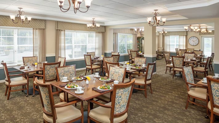 Interior dining room with tables set for a meal