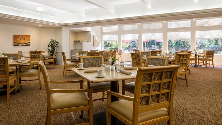 Bright dining room with tables and chairs