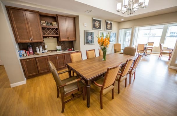 Bright dining area with a large wooden table and chairs